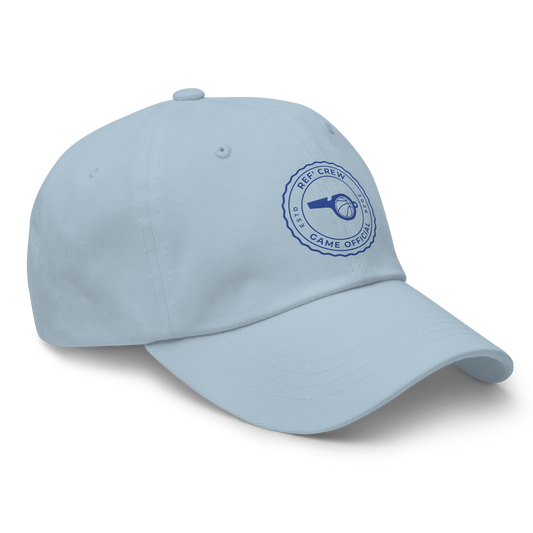 Light blue chino twill dad cap with "Ref' Crew Game Official" stamp, whistle, and basketball logo for US basketball referees.