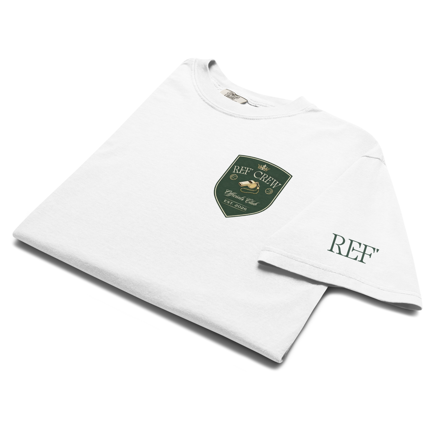White heavyweight cotton Heritage Academy Shield Tee with green, gold, and cream Ref' Crew logo.