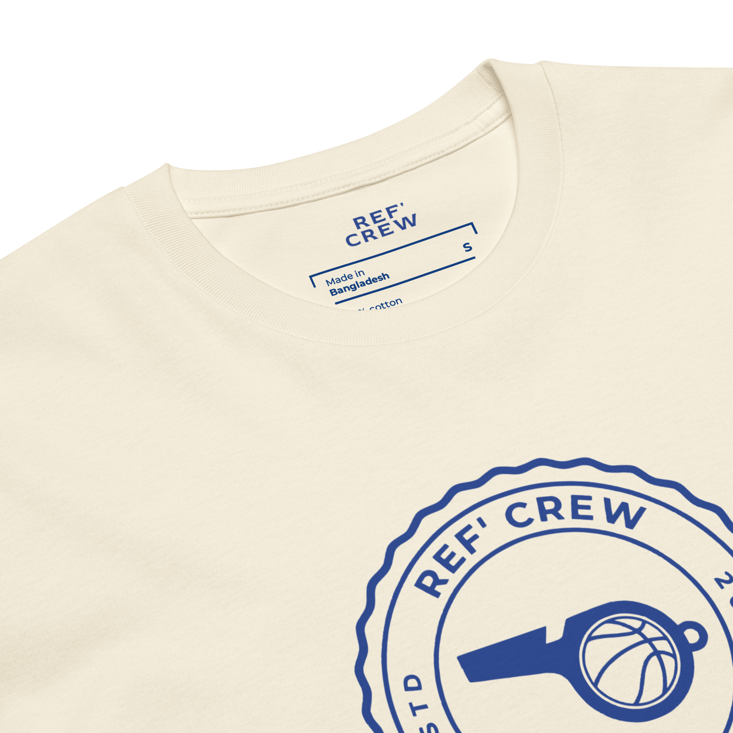 Cream AS Colour 5001 cotton tee with a blue "REF' CREW" badge logo featuring a whistle and basketball.