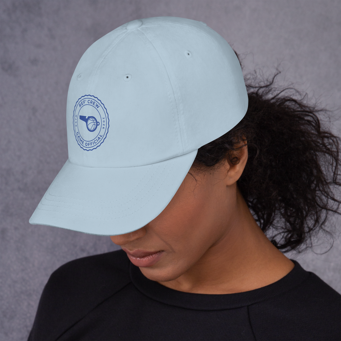 Light blue chino cotton twill dad cap with a royal blue "Ref' Crew Game Official" stamp logo.