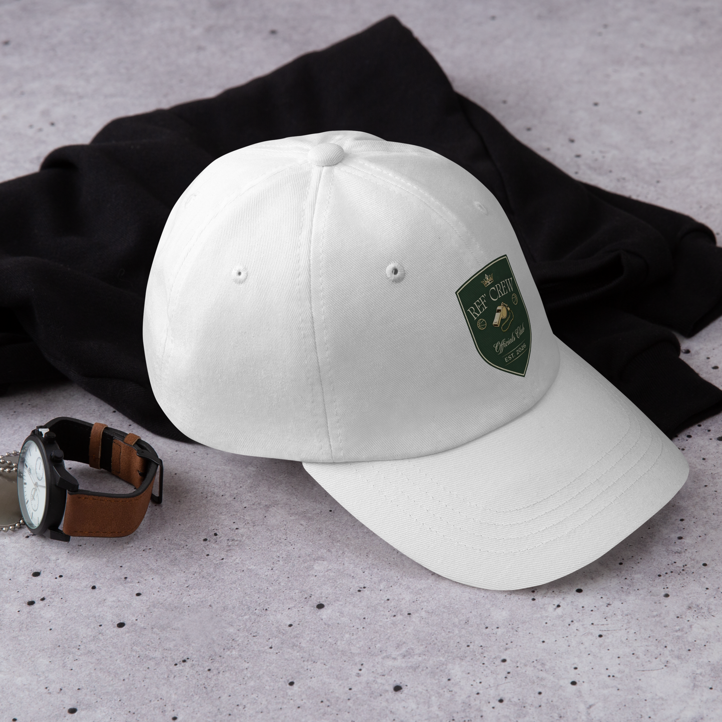 White chino cotton twill dad cap with a green and gold Ref' Crew Officials Club shield logo.