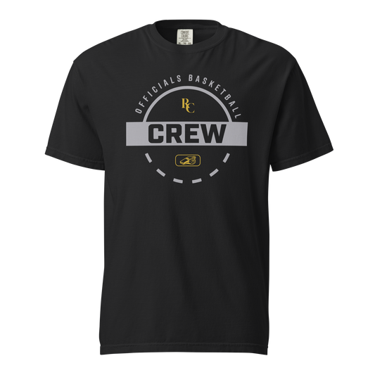 Black garment-dyed heavyweight tee, front view — circular Officials Basketball Crew badge in silver grey with a gold RC monogram and a gold whistle emblem at the center