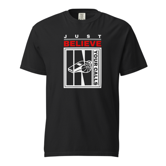 Black garment-dyed heavyweight tee, front view — JUST in spaced white caps over BELIEVE in red, with a whistle and basketball panel and YOUR CALLS running up the right edge