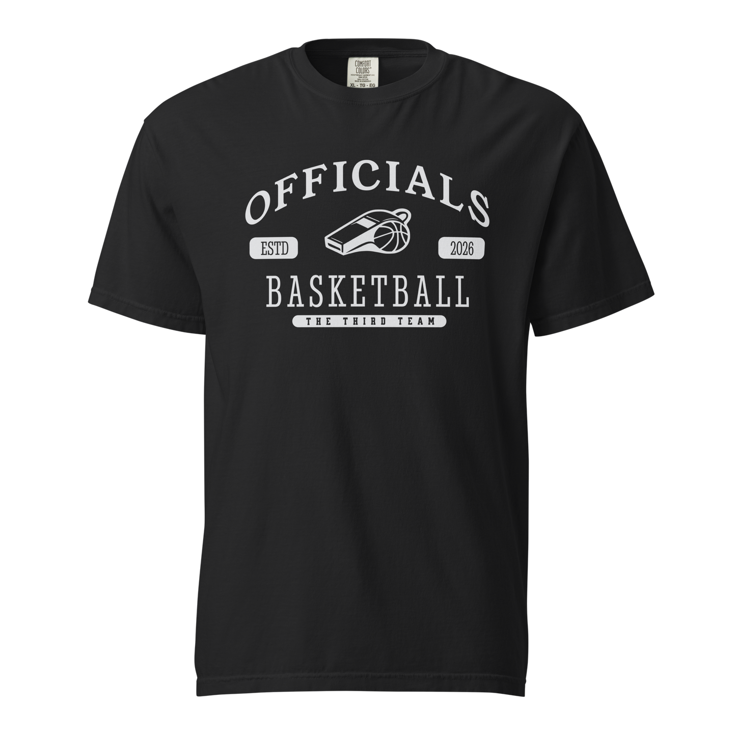 Black garment-dyed heavyweight tee, front view — OFFICIALS arched in white collegiate caps over a whistle and basketball, ESTD 2026 in pill badges, BASKETBALL blocked underneath and THE THIRD TEAM at the base