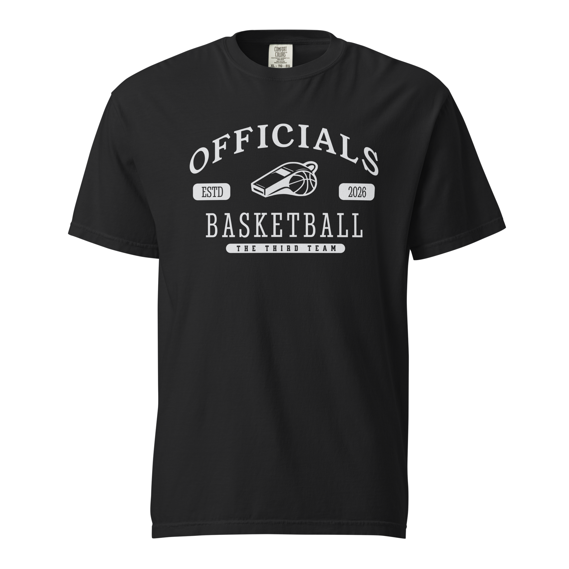 Black garment-dyed heavyweight tee, front view — OFFICIALS arched in white collegiate caps over a whistle and basketball, ESTD 2026 in pill badges, BASKETBALL blocked underneath and THE THIRD TEAM at the base