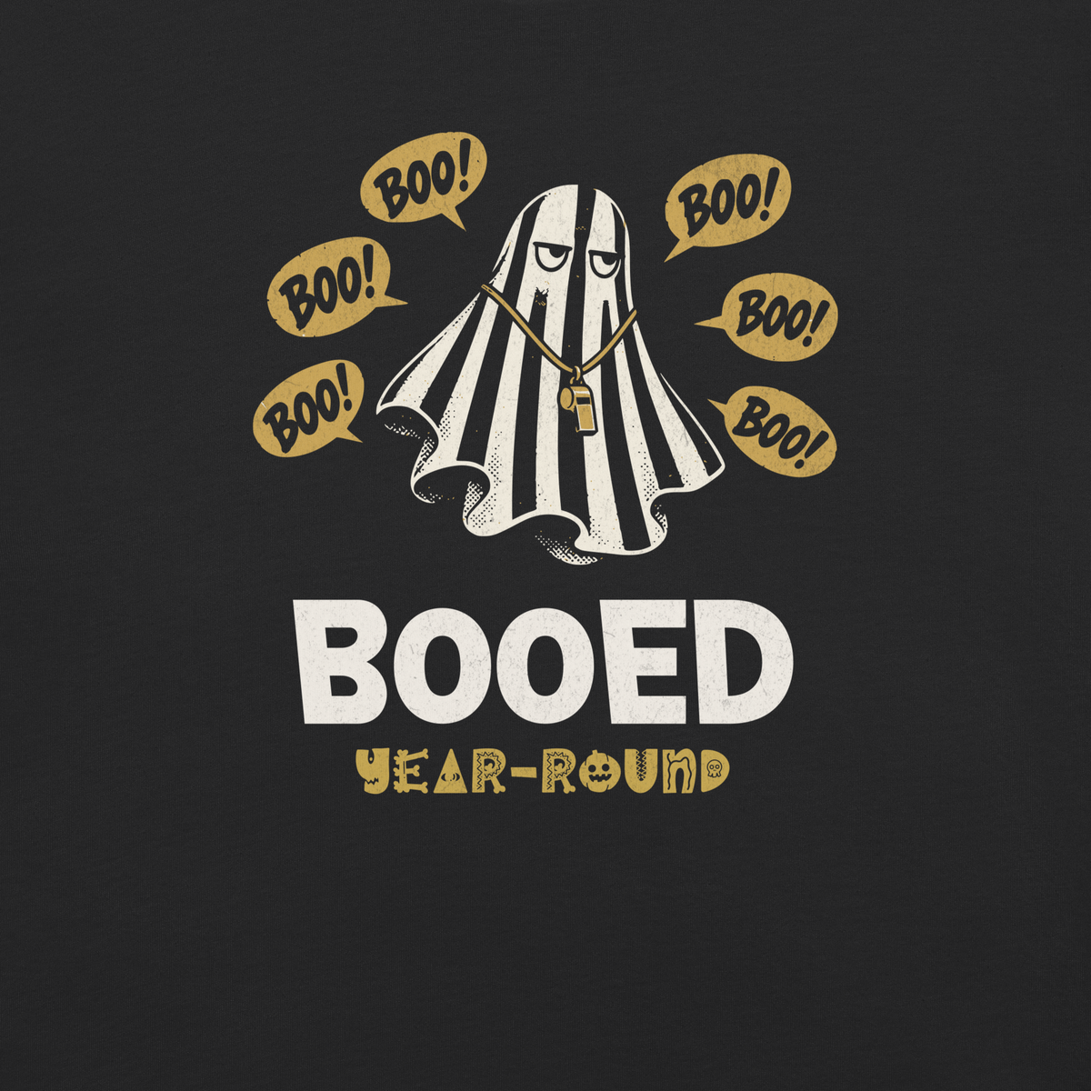 Close-up of the striped ghost referee, gold "BOO!" bubbles and "BOOED / YEAR-ROUND" lettering printed on black garment-dyed heavyweight cotton