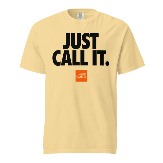 Ref' Crew "JUST CALL IT." referee t-shirt for basketball official. Pale yellow Comfort Colors tee with black text and orange whistle badge.