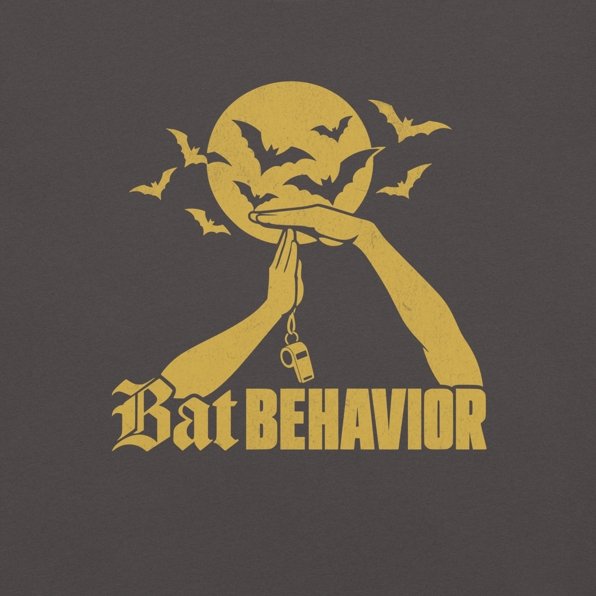 Close-up of the gold "Bat BEHAVIOR" print with full moon, bats and whistle on Graphite garment-dyed heavyweight cotton