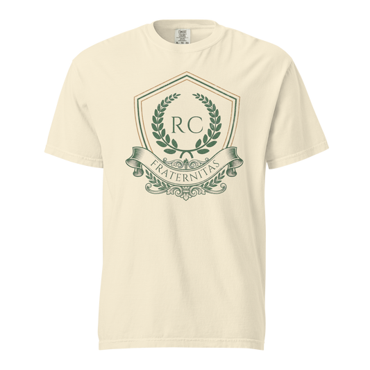 Ivory garment-dyed heavyweight tee, front view — heraldic Ref' Crew crest in forest green and copper with RC monogram, laurel wreath and FRATERNITAS banner
