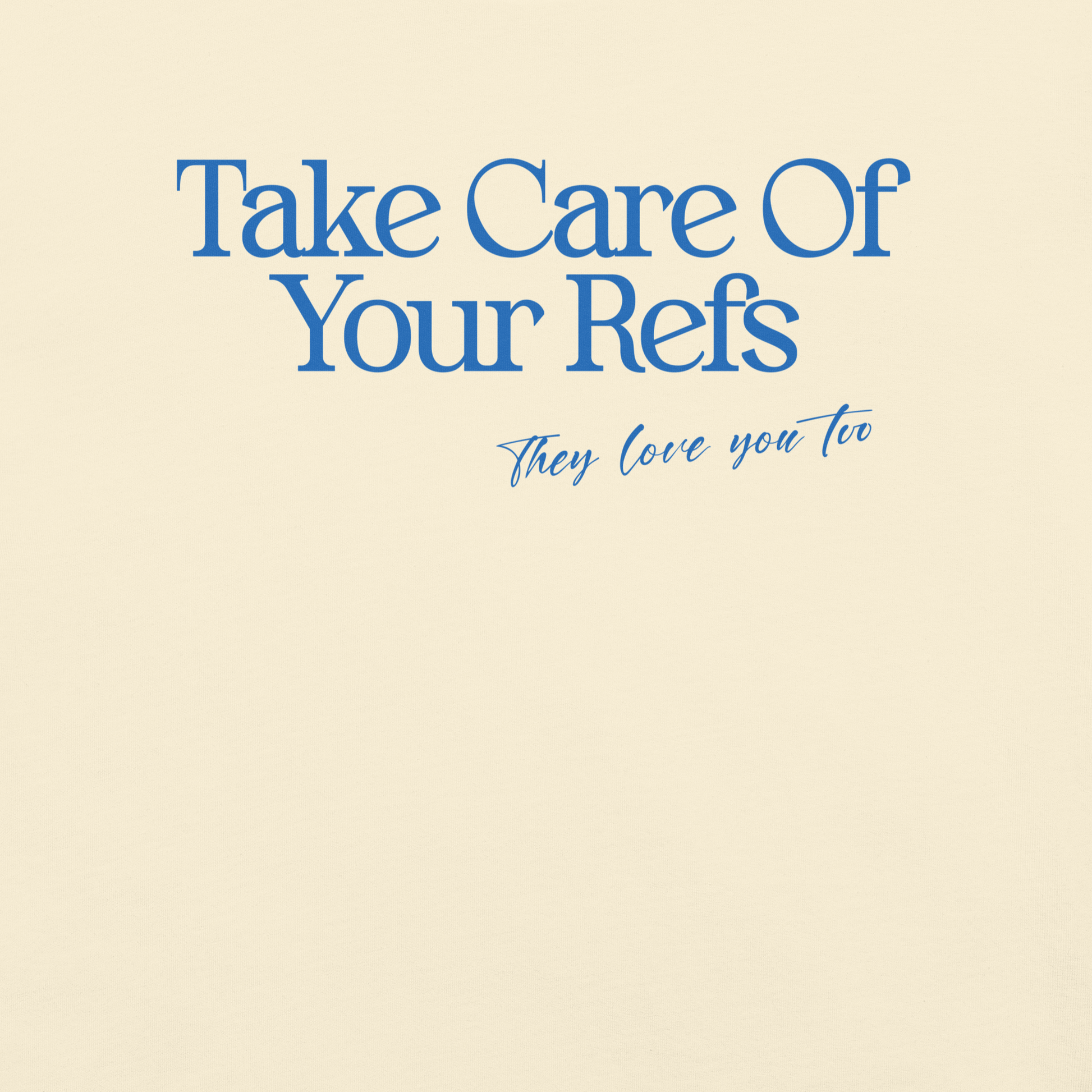 Ivory Ref' Crew Take Care Of Your Refs tee, front view — close look at the blue serif lettering and hand-scripted line