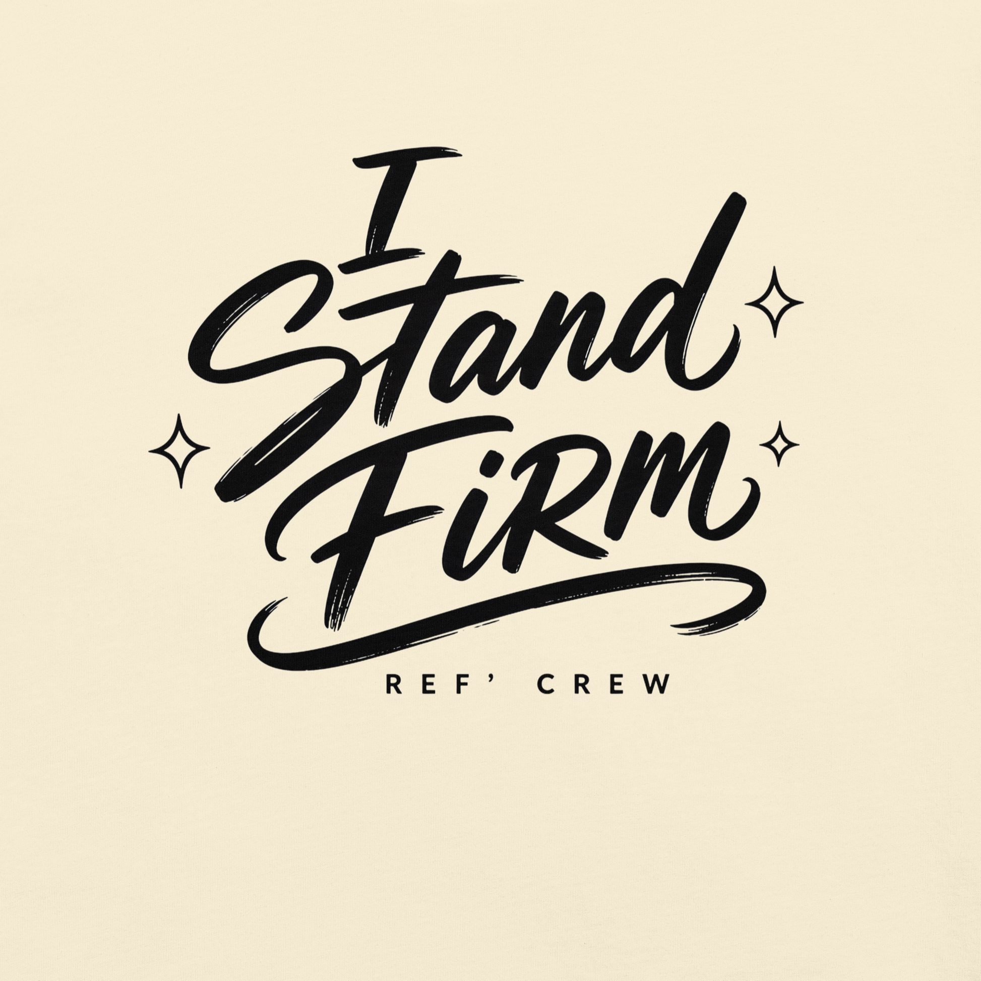 Close-up of the black "I Stand Firm" brush lettering and Ref' Crew signature on Ivory garment-dyed cotton