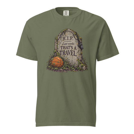That's a Travel Tee in Moss – front view, mossy tombstone engraved "R.I.P. Last words: THAT'S A TRAVEL." with a hanging whistle and a basketball in the grass – Ref' Crew basketball referee Halloween tee