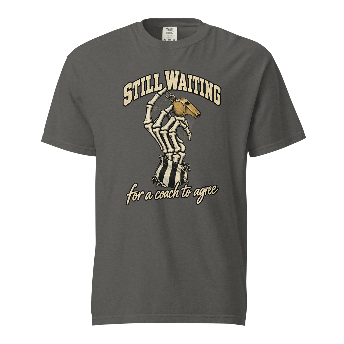 Still Waiting Tee in Pepper – front view, skeleton hand in a torn referee-stripe sleeve holding a gold whistle, "STILL WAITING for a coach to agree" – Ref' Crew basketball referee Halloween tee
