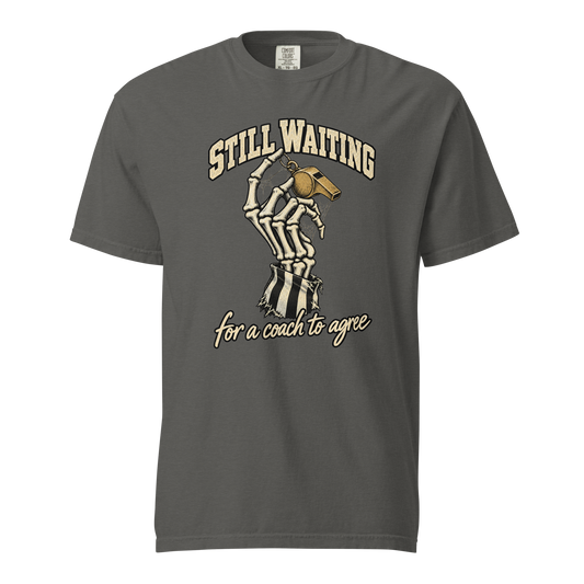 Still Waiting Tee in Pepper – front view, skeleton hand in a torn referee-stripe sleeve holding a gold whistle, "STILL WAITING for a coach to agree" – Ref' Crew basketball referee Halloween tee