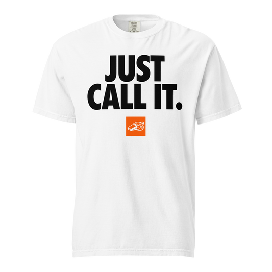 White Comfort Colors heavyweight cotton tee with "JUST CALL IT." in black, and an orange whistle badge. Ref streetwear.
