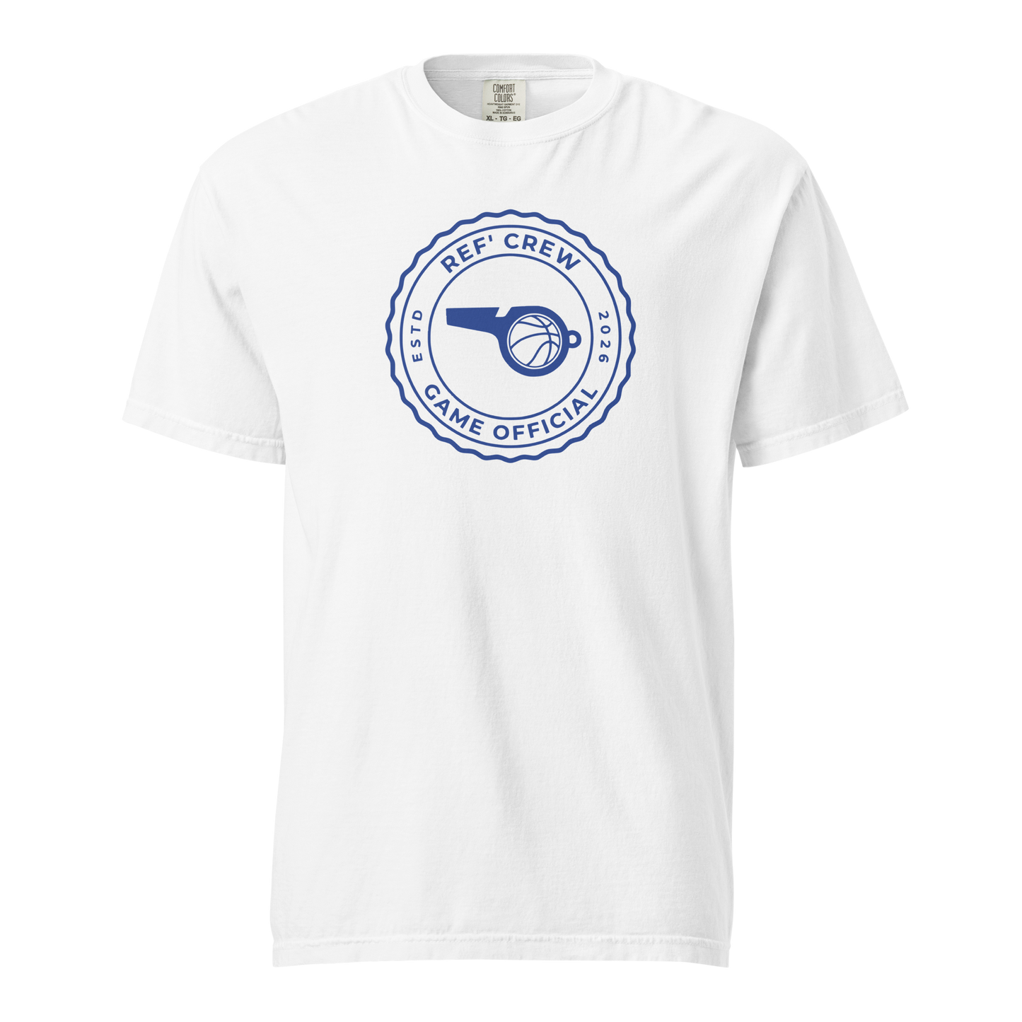White garment-dyed heavyweight tee, front view — royal blue circular Ref' Crew Game Official seal with whistle, basketball and ESTD 2026