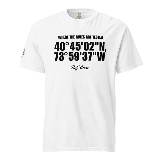 The Coordinates Tee in white — front view. Bold coordinates across the chest with "Where the rules are tested" above and the Ref' Crew signature below, on garment-dyed heavyweight cotton.