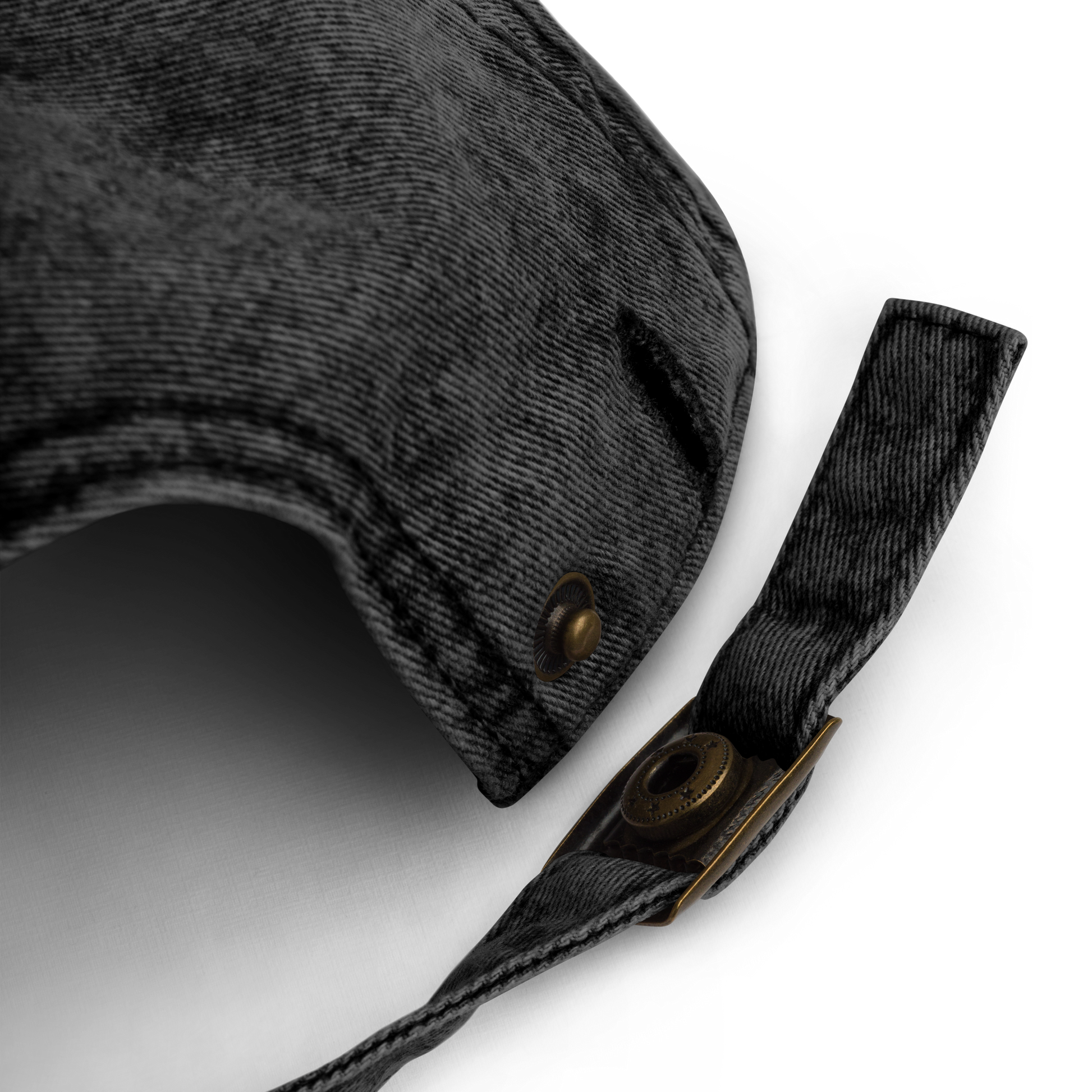 Washed black cotton twill dad cap with brass buckle, perfect for off-duty basketball referees.