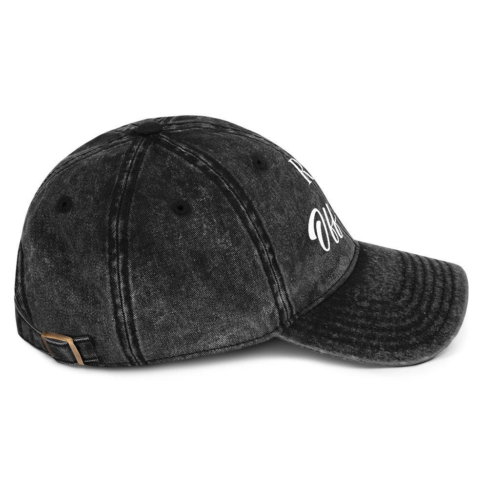 Washed black vintage cotton dad cap with "REF' Off-Duty" in white, adjustable brass buckle.